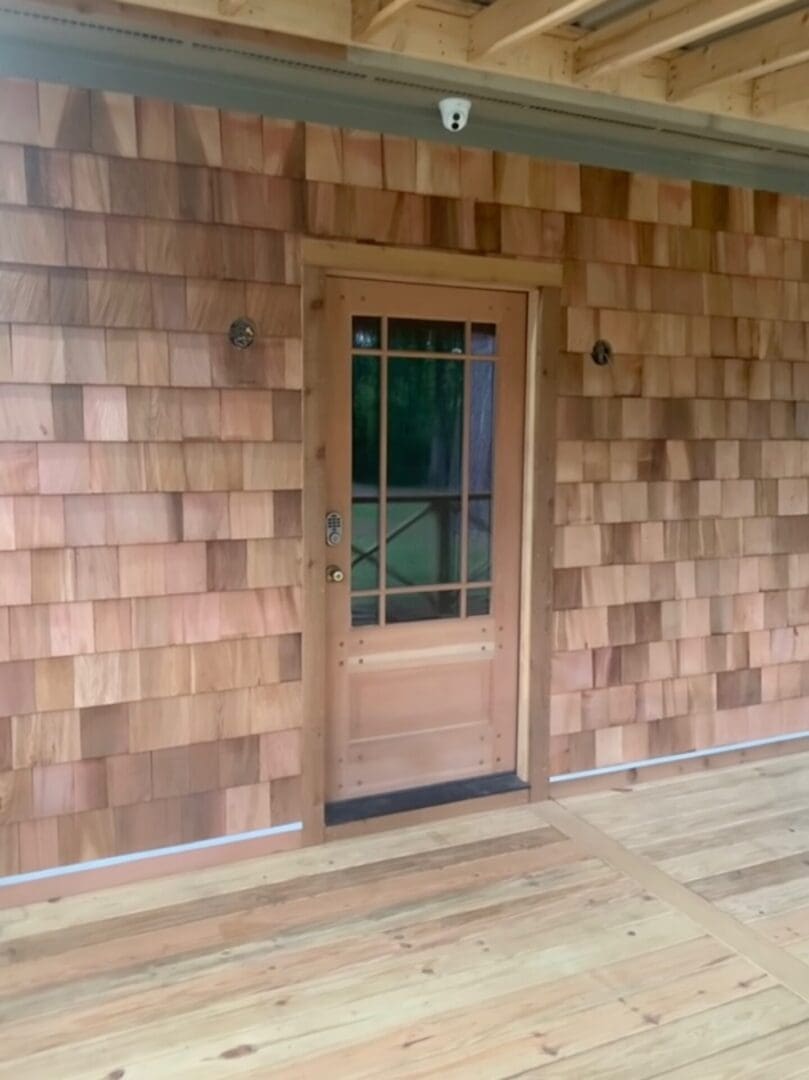 A door that is in front of a wall.